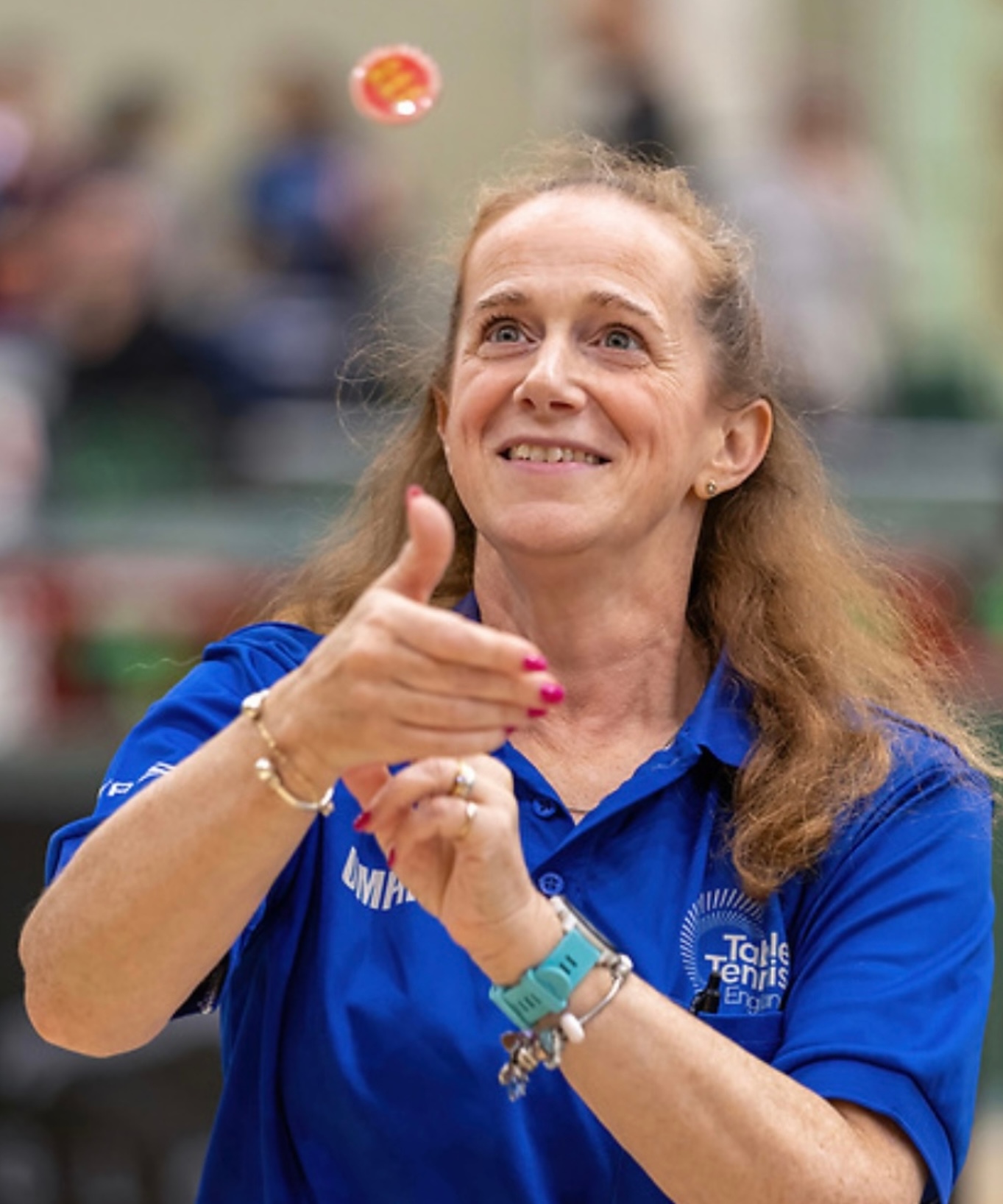 Sandy umpiring doing a coin toss at the start of a match